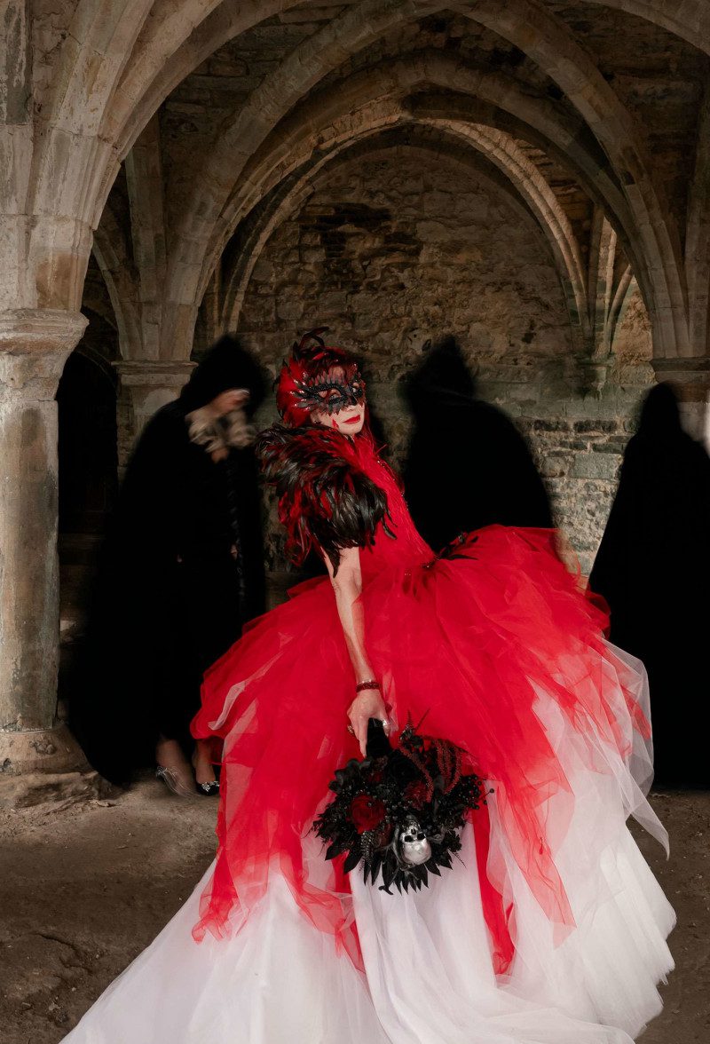 theatrical red white black wedding theme feather wings corset dress