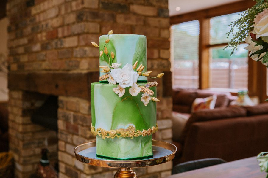 elegant modern green white marble wedding cake gold detailing