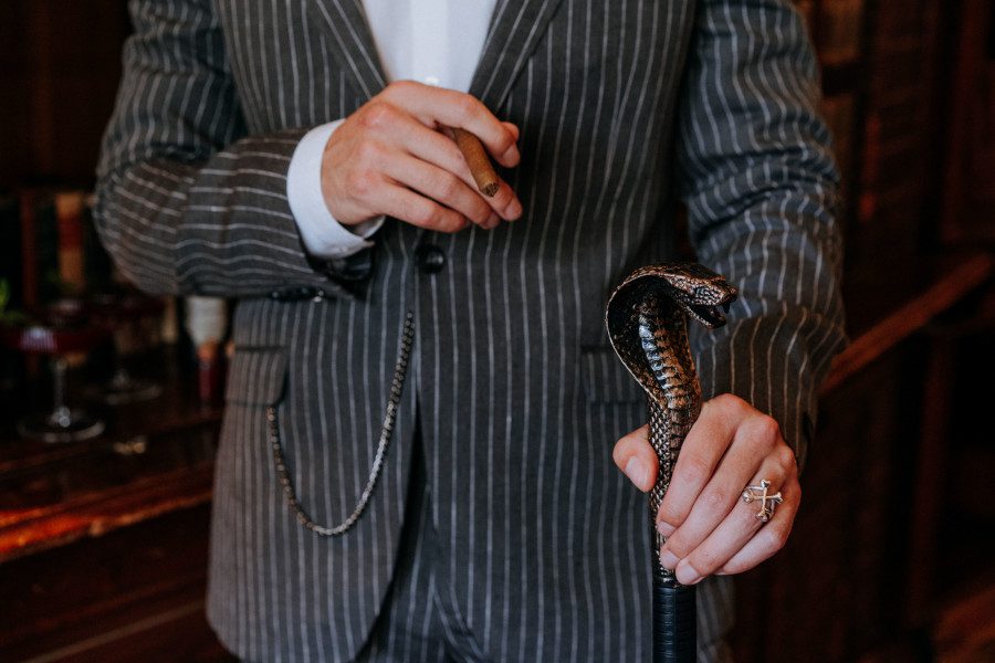 gomez addams groom pinstripe suit cigar silver bone ring snake cane