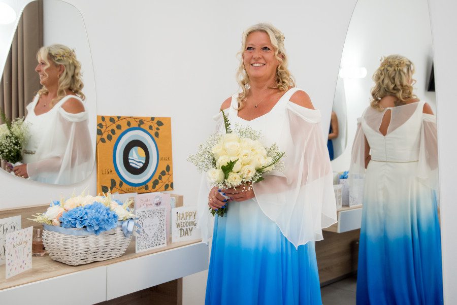 peak a boo cut out off shoulder detail dress colourful bright vibrant cerulean blue bride wedding