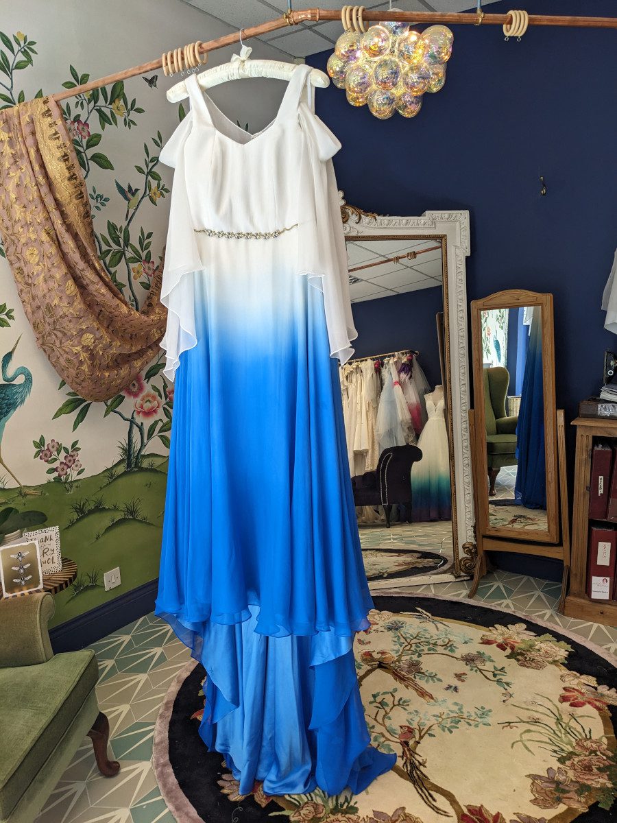 bright vibrant sky sea blue off shoulder wedding dress dorking surrey