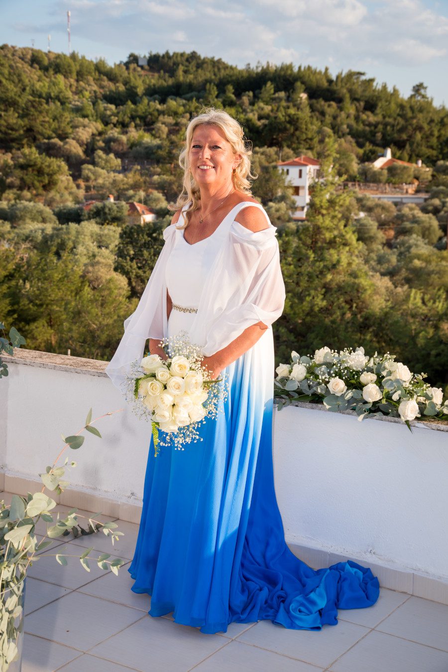 mature older blonde tan bride greek wedding grecian inspired floaty elegant layered wedding dress