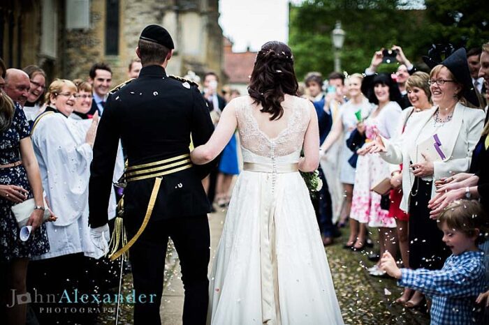 bespoke wedding dress with sash for military wedding confetti