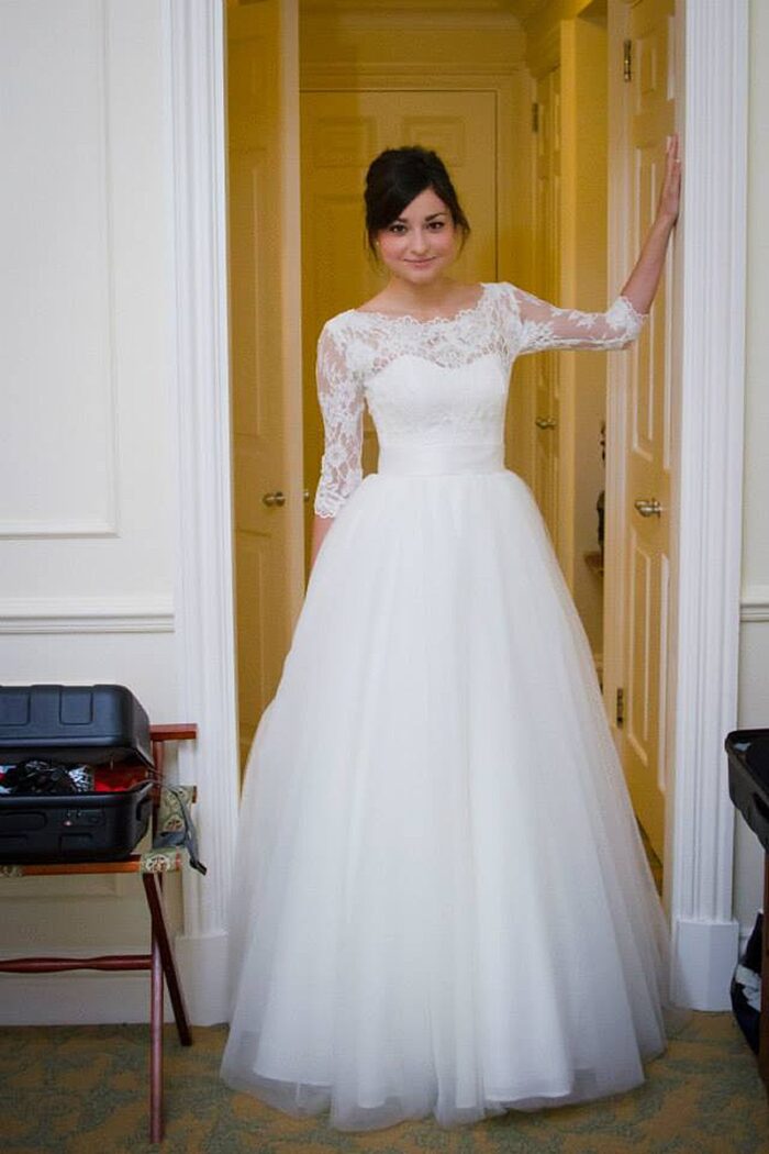 bride wearing traditional lace wedding dress tulle skirt