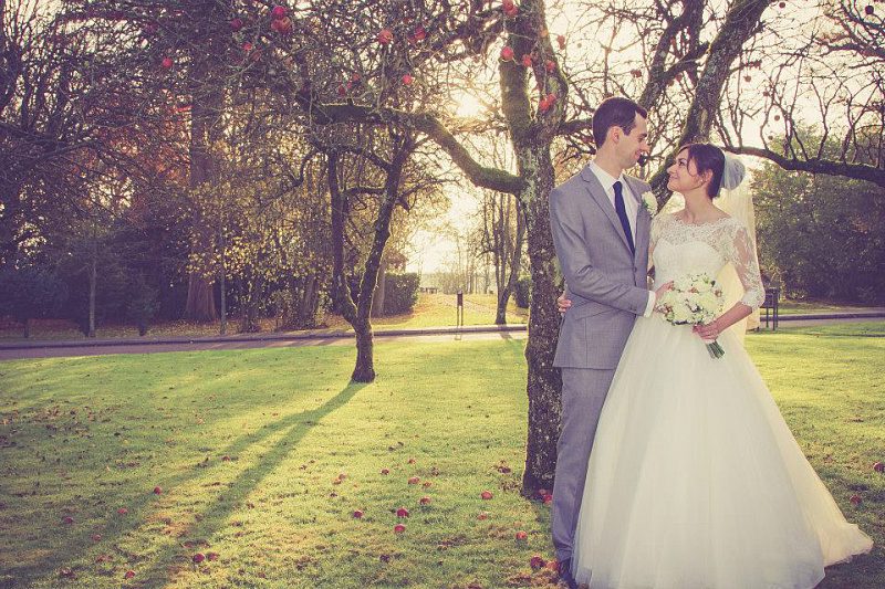 ethereal tulle and lace bespoke wedding dress countryside setting with apple trees
