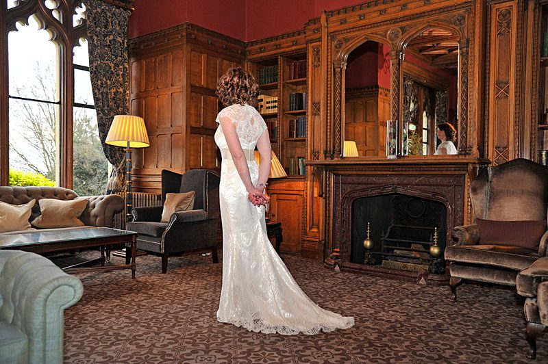 slim fit wedding gown in a grand hotel room