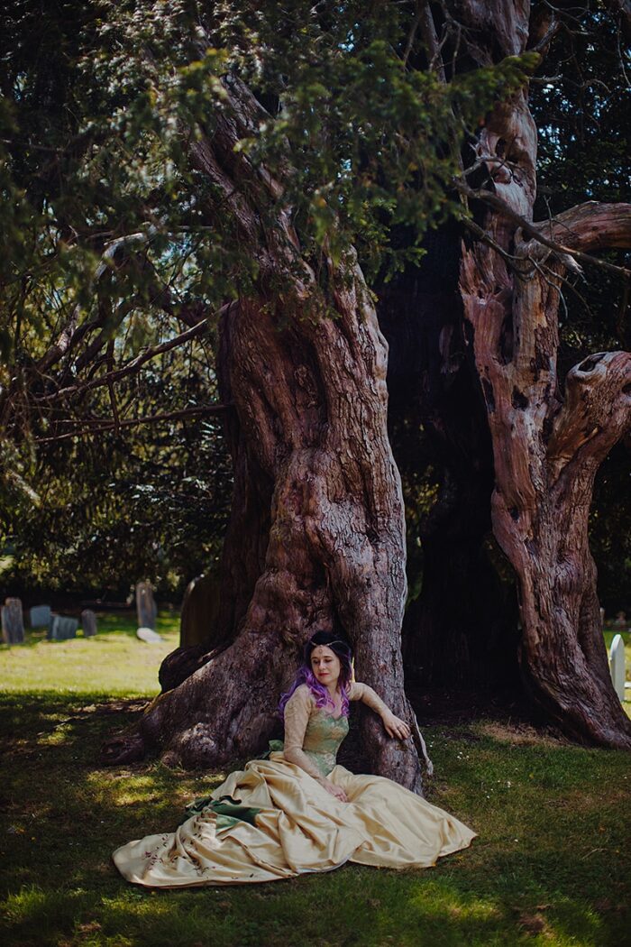 gold-wedding-dress-by-a-yew-tree