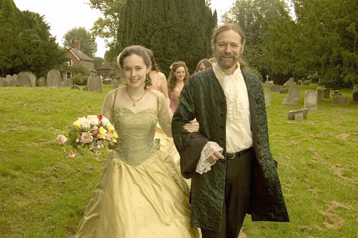 bride with father in highway man coat