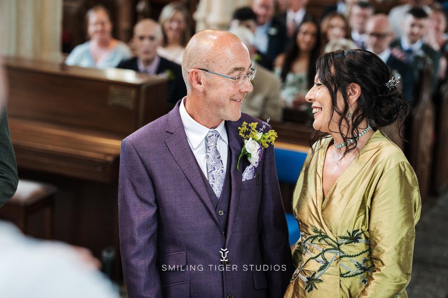 thistle flower embroidered wedding dress purple suit groom bride church ceremony