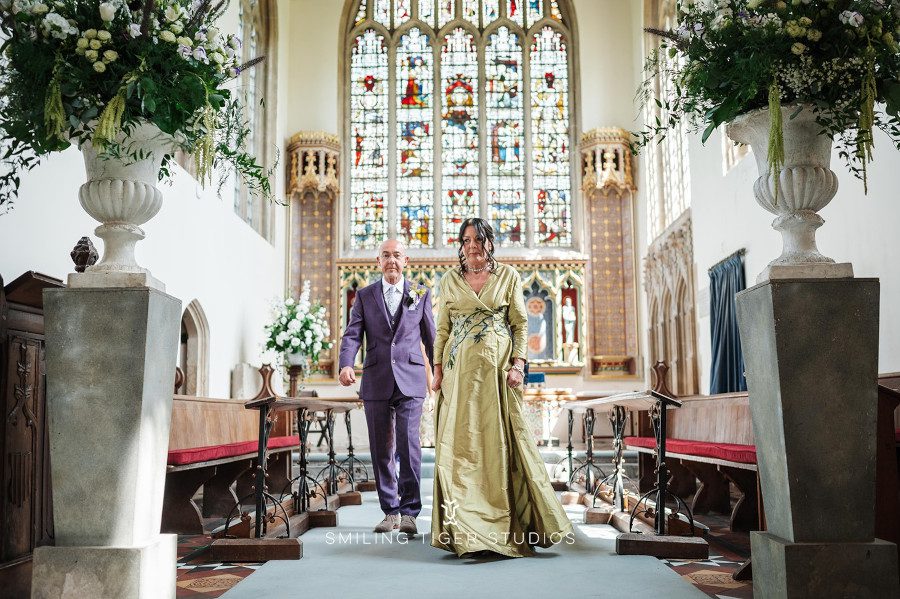 church ceremony stain glass full length wrap around cross over bespoke green wedding dress