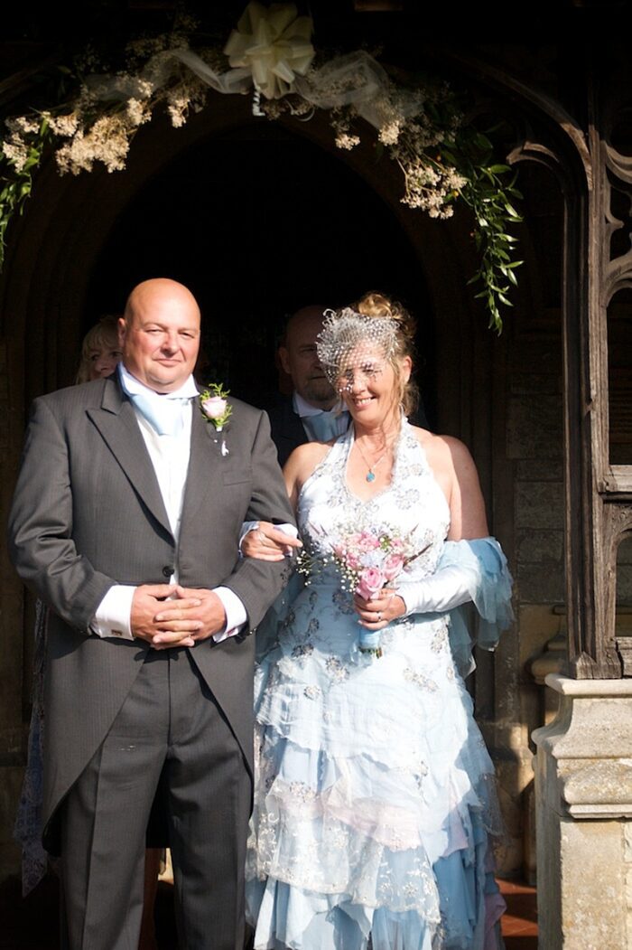 wedding couple in porch blue wedding dress