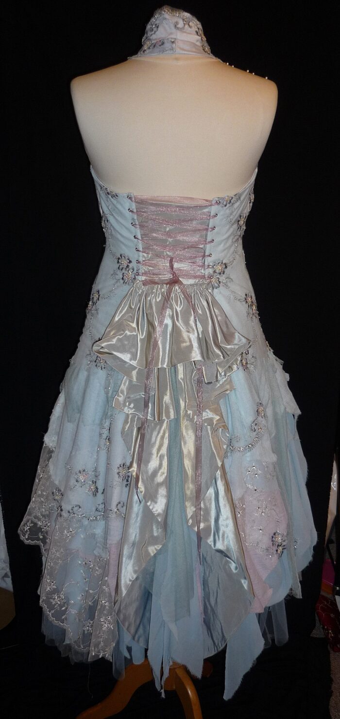 torn layers of lace and muslin wedding dress