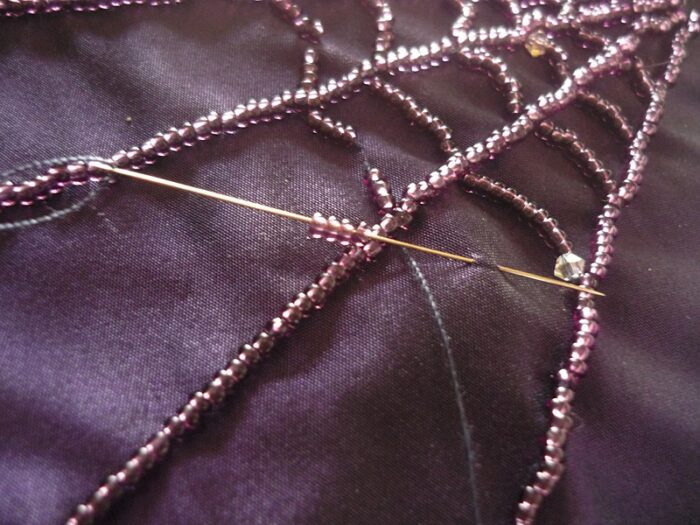 Halloween beaded wedding dress spiderweb beading detail