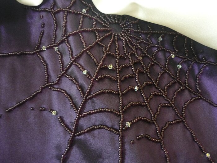 purple Halloween wedding dress spiderweb beading detail