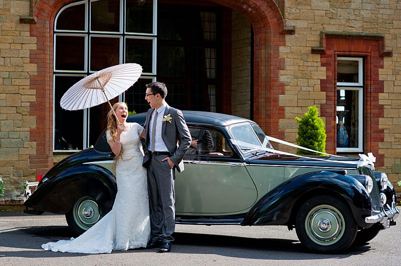 modest bridal couple with car