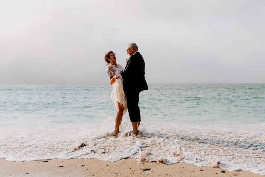 mature bride groom couple unique elegant bridal outfit wedding dress beach cornwall wedding