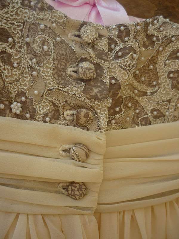 cover button and buttonhole detail on bespoke christening gown