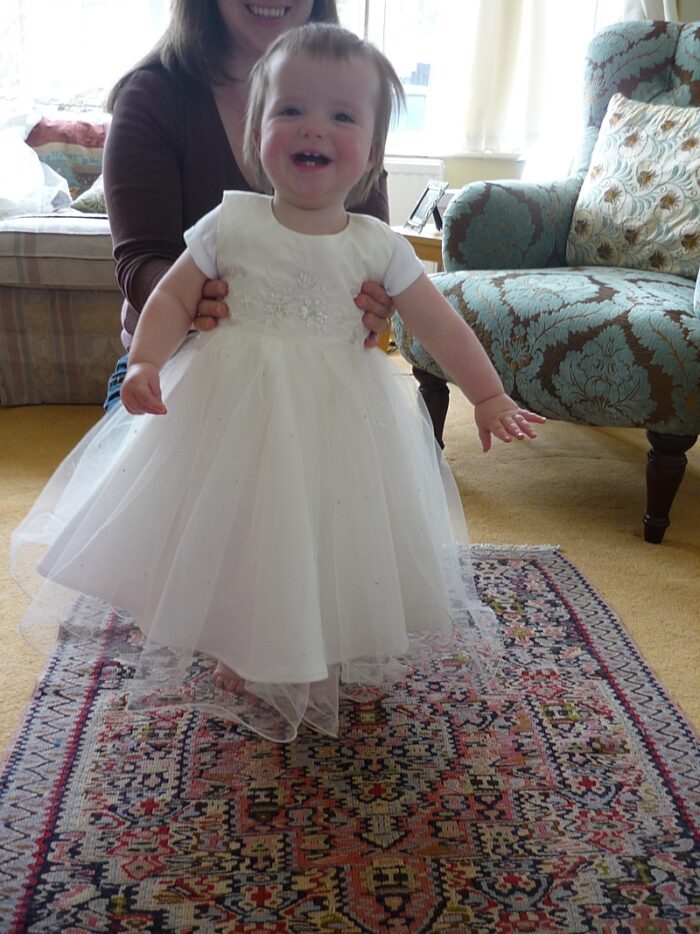 fitting for baby in custom christening dress