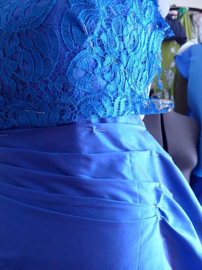 couture dress on the stand ruching detail lace and silk