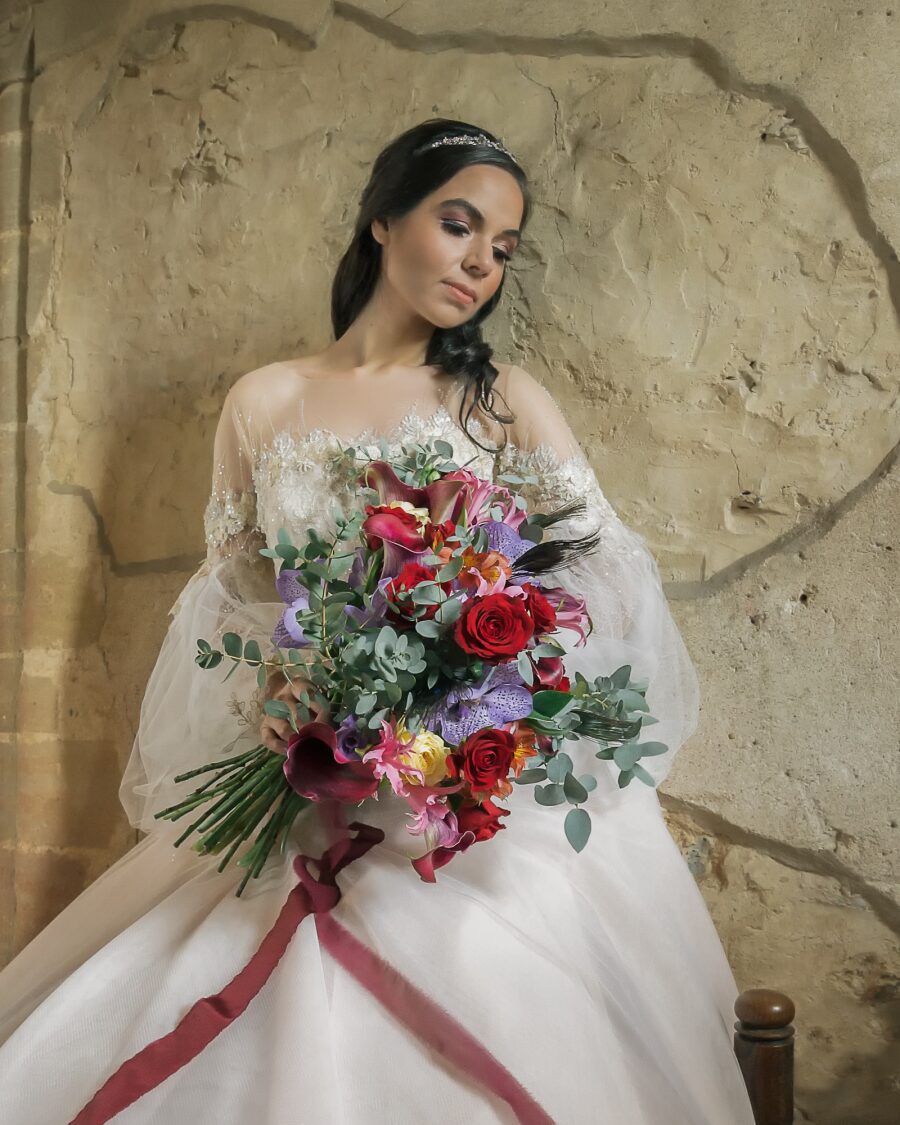 vibrant purple red pink wedding bouquet ribbon off shoulder wedding dress
