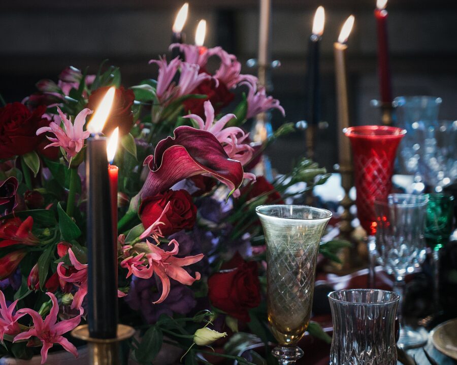 dark red pink purple flowers candles glasses atmospheric gothic wedding