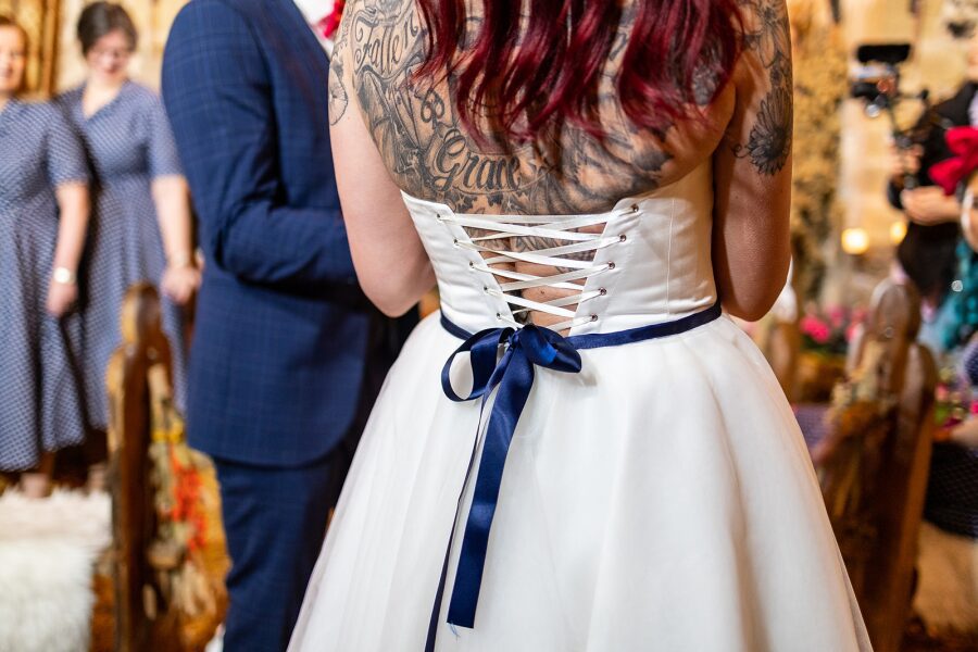 corset back lace up navy blue ribbon wedding dress tattooed bride