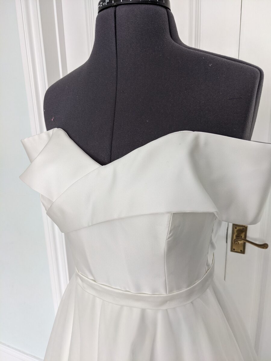 off shoulder statement sweetheart neckline sleeveless duchess satin wedding dress