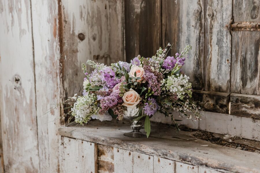 pastel purple white cream light pink coral lilacs roses stocks wedding bouquet
