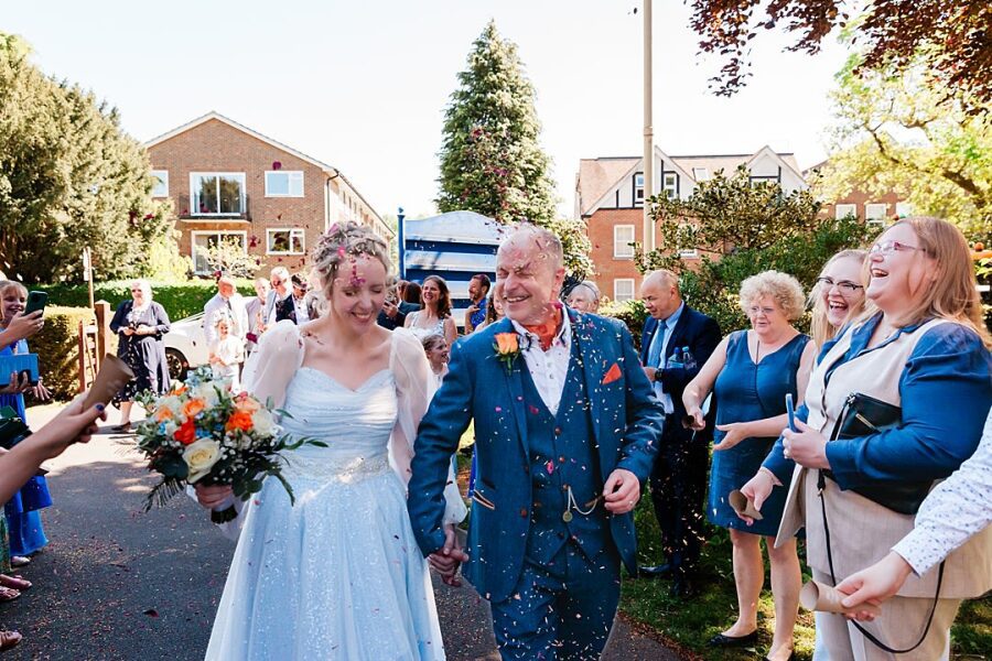 uk english wedding confetti shower outdoor blue theme wedding guests sheer chiffon sleeves