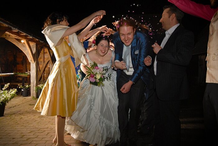 confetti arch bridesmaid bride and groom surrey