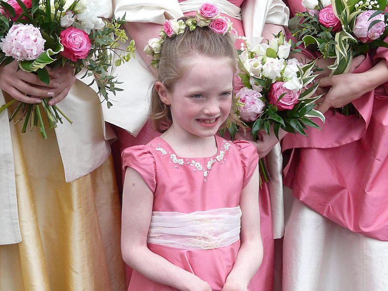 handmade child bridesmaid dress in mid pink silk dupion with puffed sleeves
