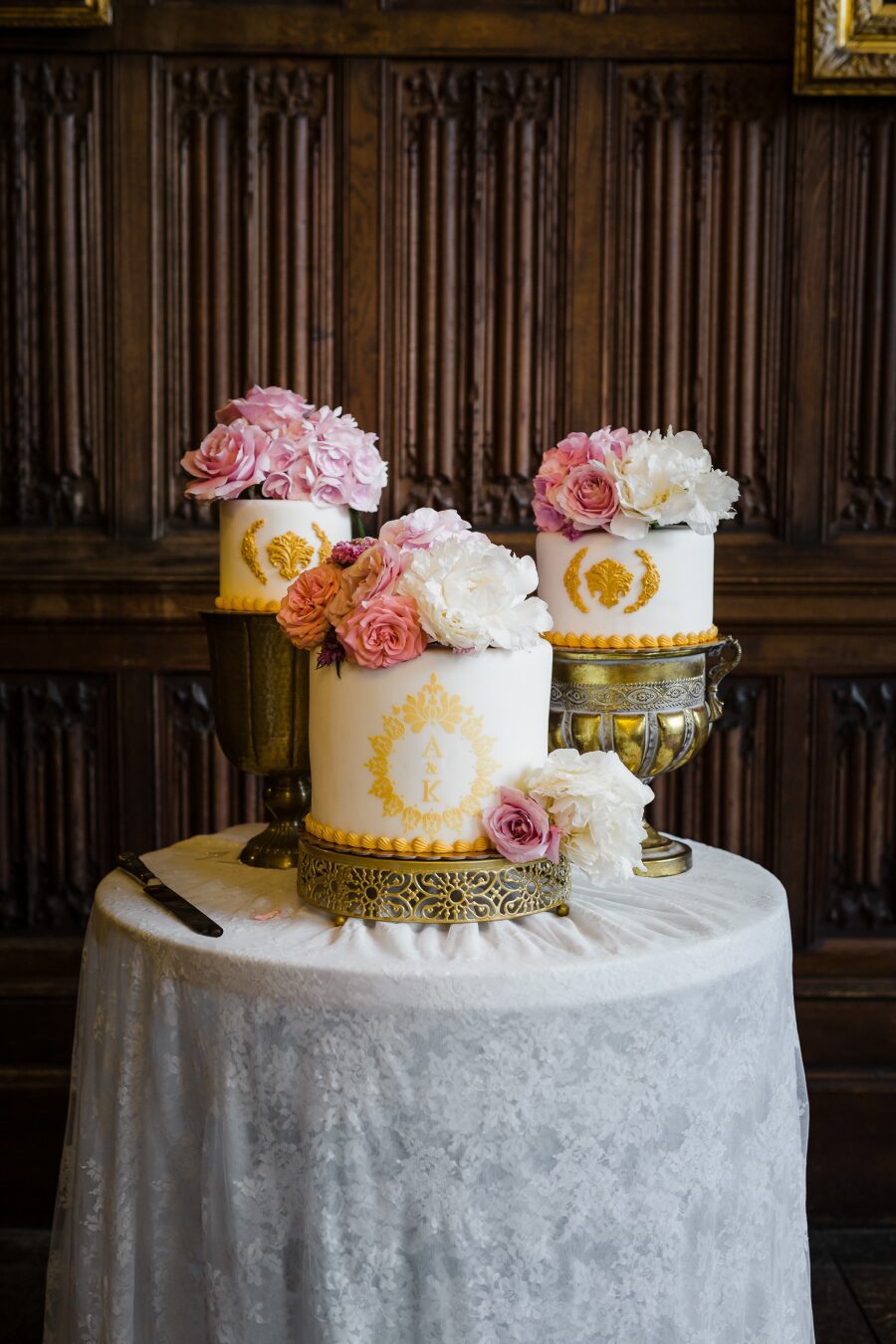 wedding cake separate tiers real flowers monogrammed filigree gold detailing