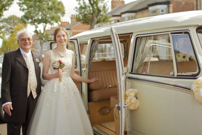 vintage bride with campervan wedding transport