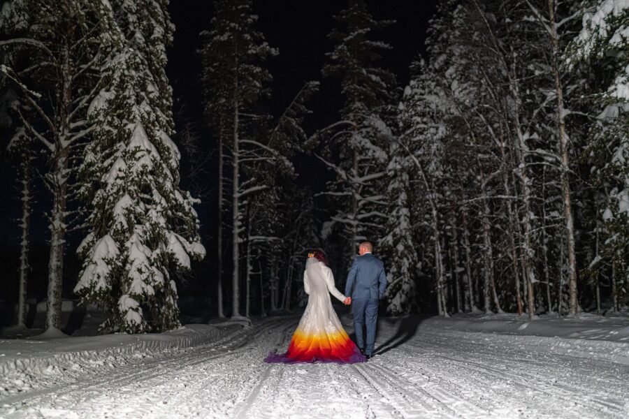 atmospheric winter snow lapland destination wedding splash pop colour wedding dress