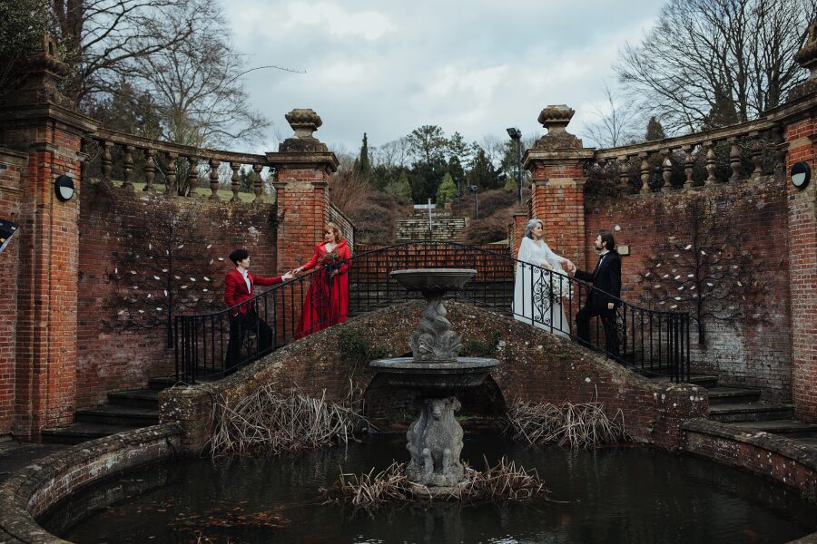 dramatic manor house wedding red queen king hearts white diamonds couples fountain stone steps