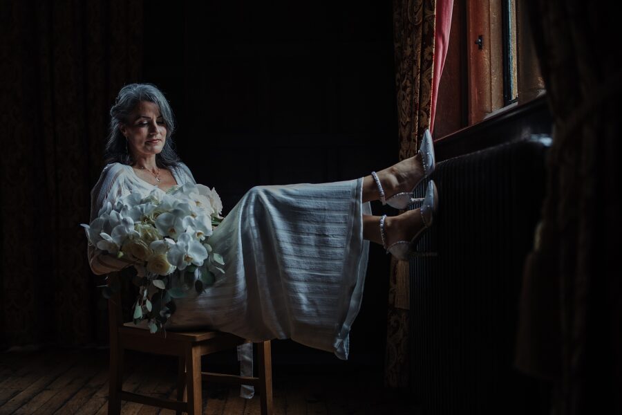 beautiful elegant older mature bride grey hair white geometric wedding dress inspiration