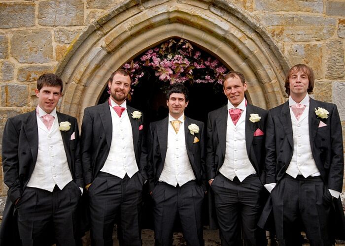 bespoke waistcoats in ivory brocade with silk cravats in pinks and gold