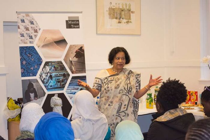 Begum presenting the project in muslin jamdani sari