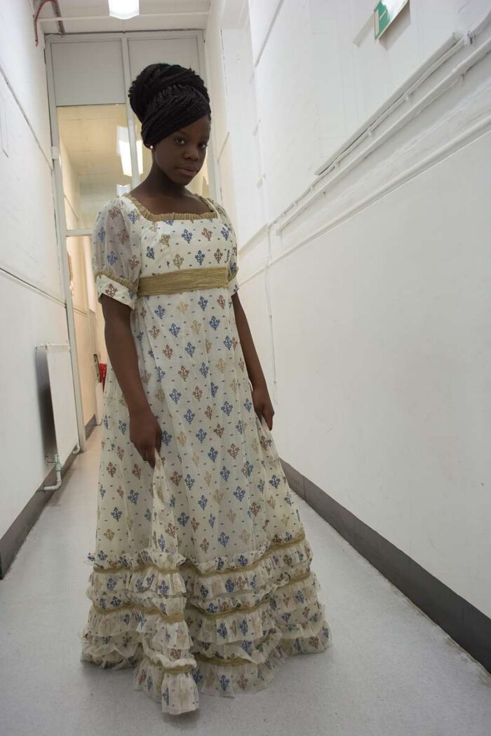 finished regency gown on model with gold organza