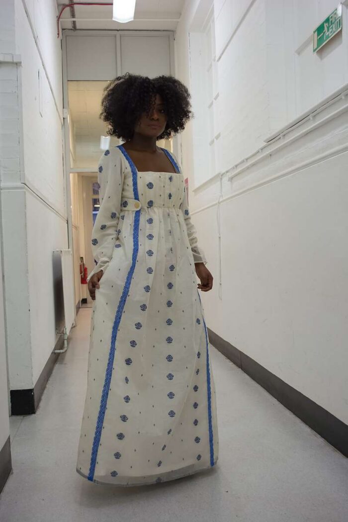 finished gown on model with blue cotton trim