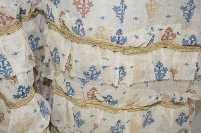 detail of pinked ruffles on regency cotton dress