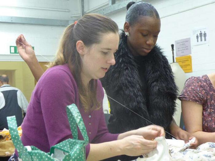 tutor Felicity Westmacott teaching historical hand stitching