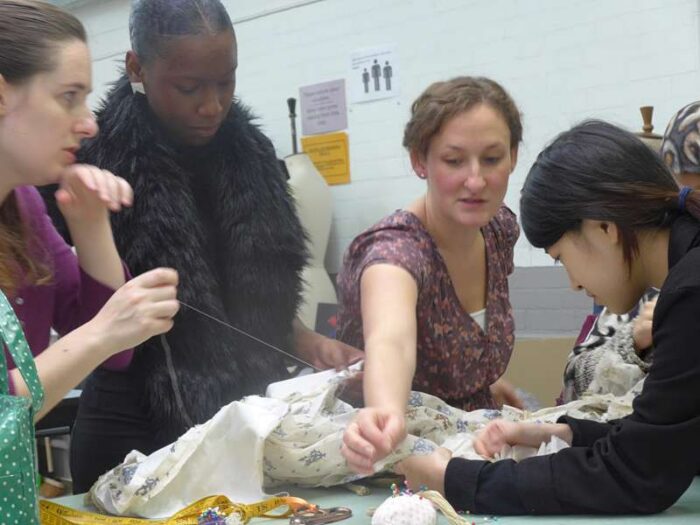 tutor Eleanor Parr-Bell teaching period hand sewing